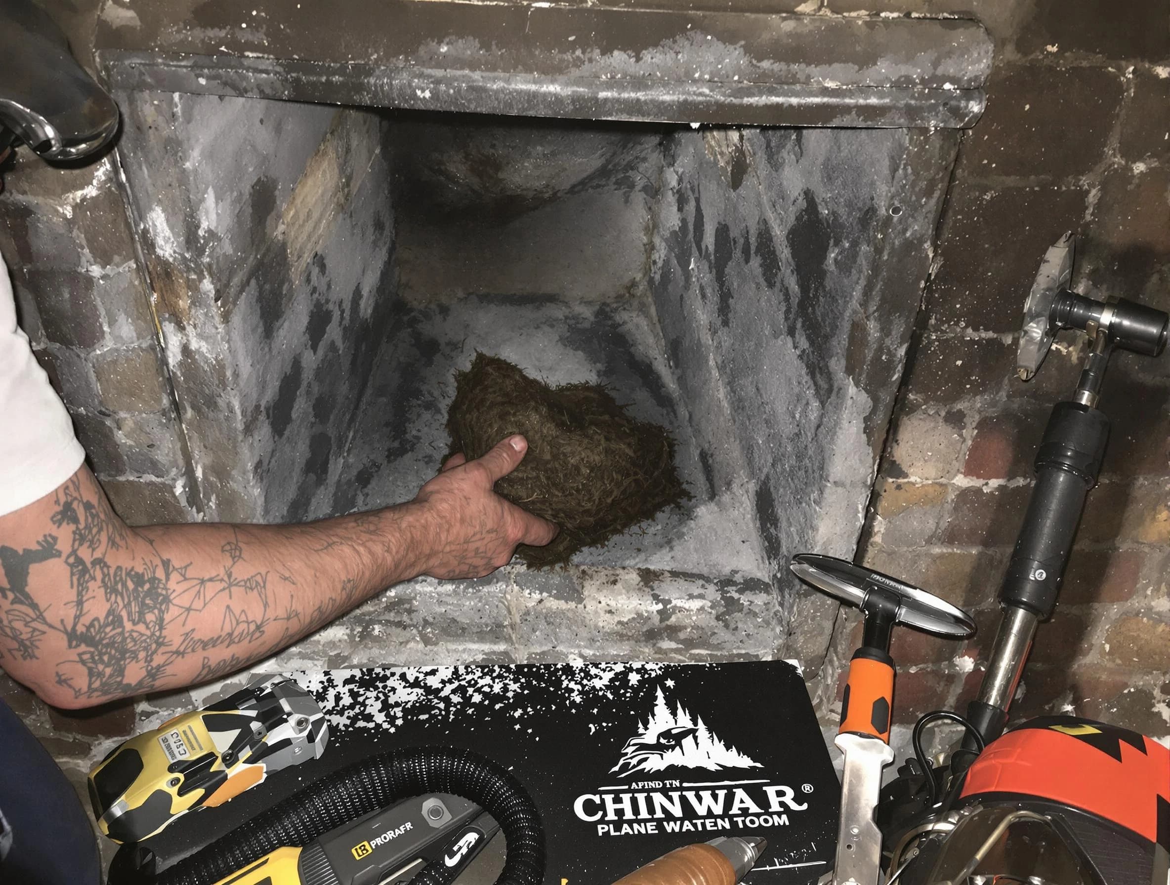 Covington Chimney Sweep safely removing debris and screening chimney in Covington, GA